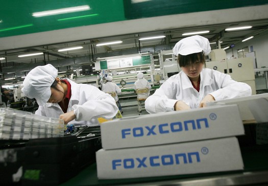 Workers are seen inside a Foxconn factory in the township of Longhua in the southern Guangdong province